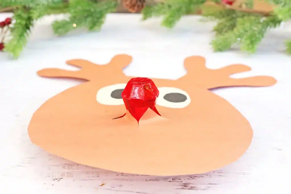 Rudolph Ring Pop Craft - Cultivating Brilliant Minds a reindeer craft made of construction paper using a ring pop as the nose