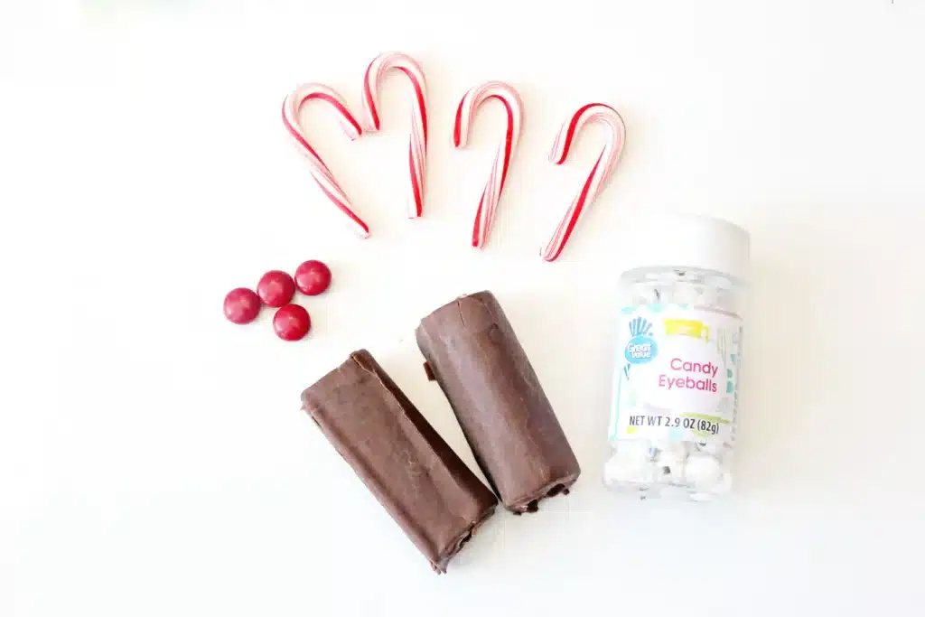 Swiss Roll Rudolph - Cultivating Brilliant Minds swiss rolls, candy canes, red m&ms, and candy eyes