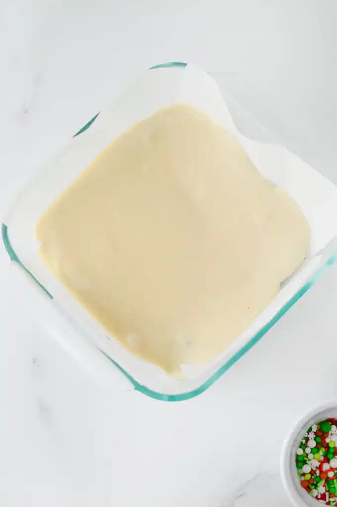 Christmas Fudge - Cultivating Brilliant Minds a layer of white chocolate in a baking pan