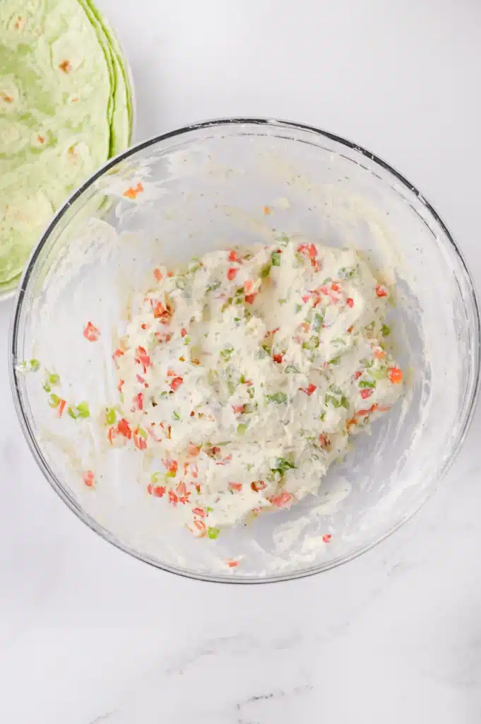 Christmas Pinwheels - Cultivating Brilliant Minds cream cheese with veggies mix in