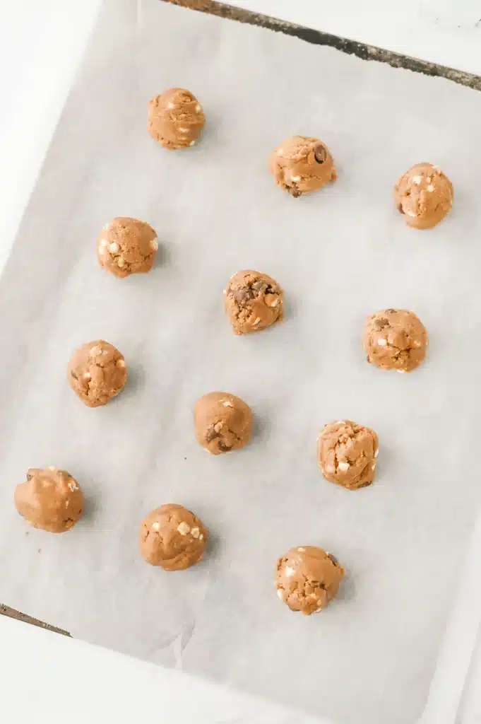 Hot Chocolate Cookies - Cultivating Brilliant Minds hot chocolate cookie dough rolled into balls on parchment paper
