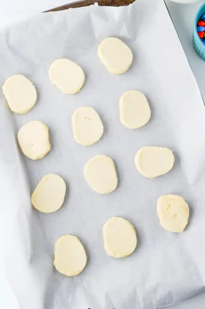 Melted Snowman Cookies - Cultivating Brilliant Minds sugar cookie dough on parchment paper