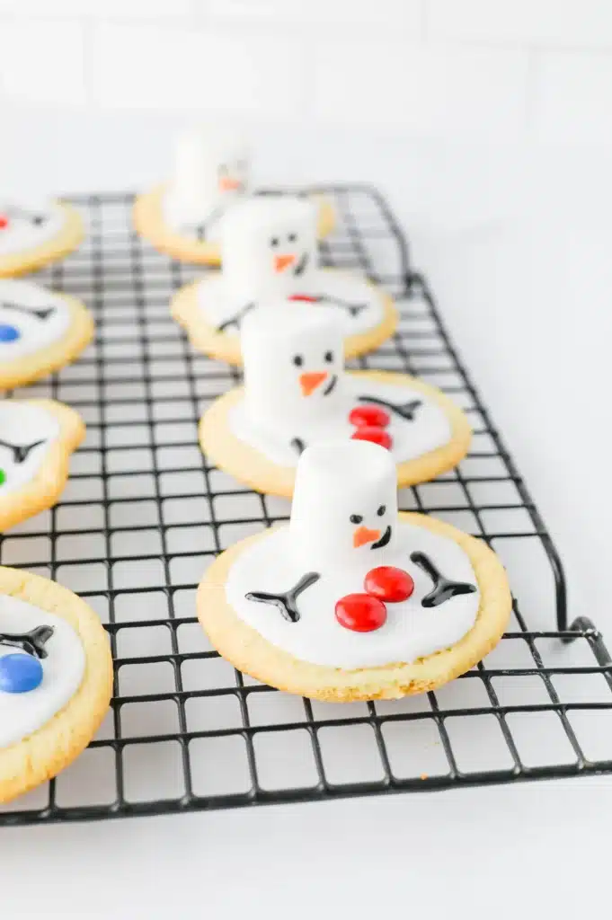 Melted Snowman Cookies - Cultivating Brilliant Minds cookies decorated to look like melted snowmen