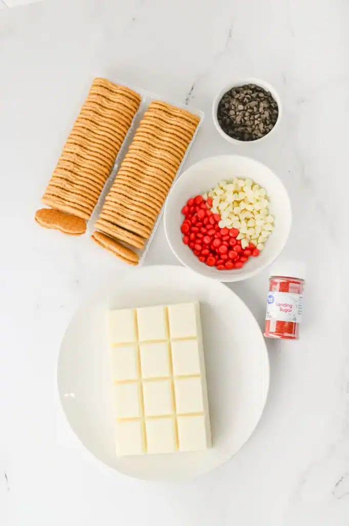 Santa Nutter Butters - Cultivating Brilliant Minds nutter butters, vanilla almond bark. red and white candy melts, red sanding sugar, and chocolate chips