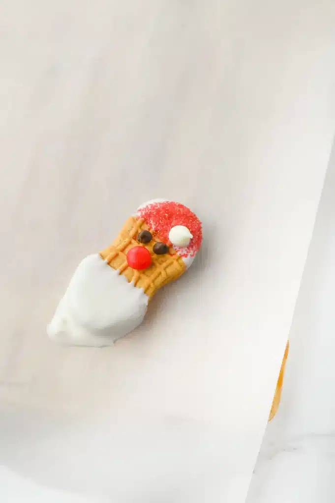 Santa Nutter Butters - Cultivating Brilliant Minds nutter butters decorated to look like Santa