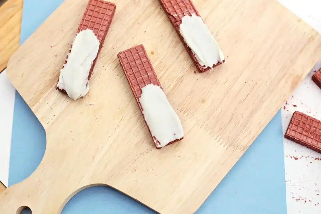 Penguin Wafers - Cultivating Brilliant Minds chocolate wafers with melted chocolate smeared on the bototm