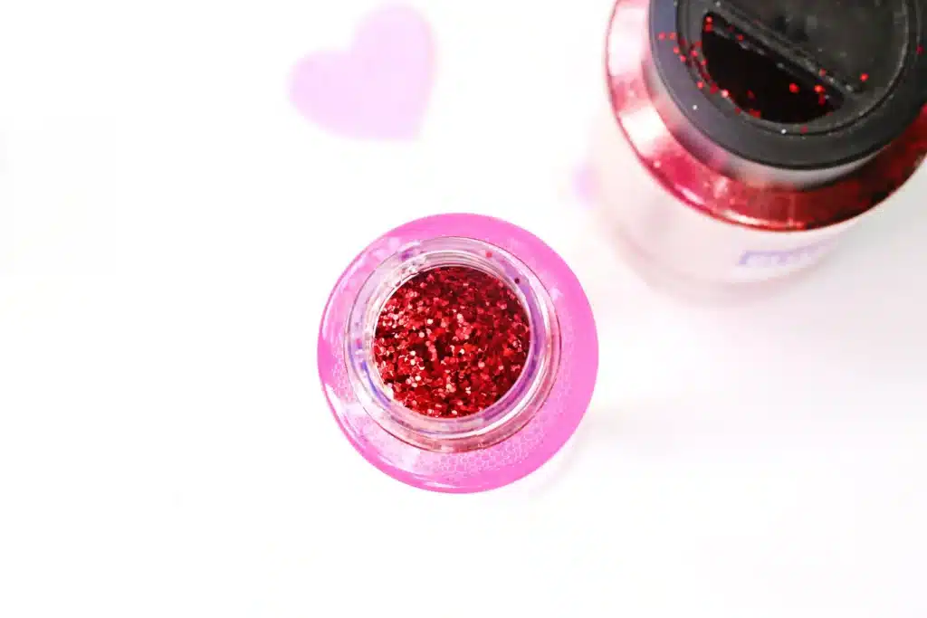 Love Potion Valentine Sensory Bottle - Cultivating Brilliant Minds add red glitter on top
