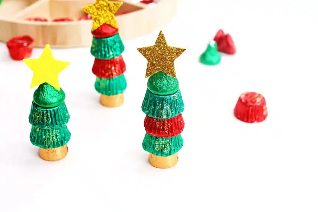 Candy Christmas Tree - Cultivating Brilliant Minds candies stacked on top of each other with a star sticker on top to look like a christmas tree
