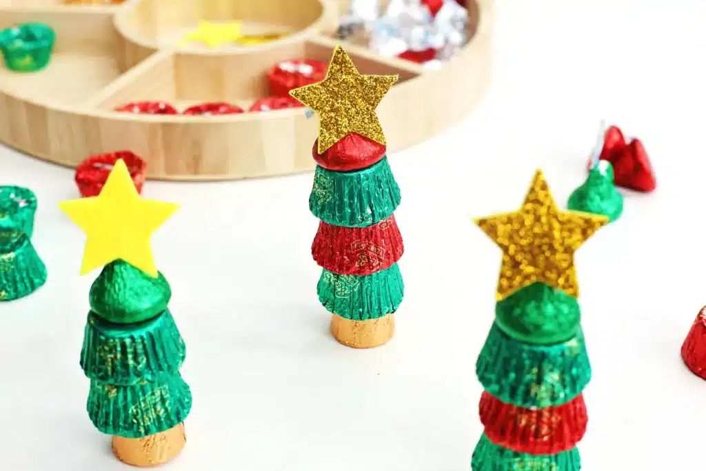 Candy Christmas Tree - Cultivating Brilliant Minds candies stacked on top of each other with a star sticker on top to look like a christmas tree