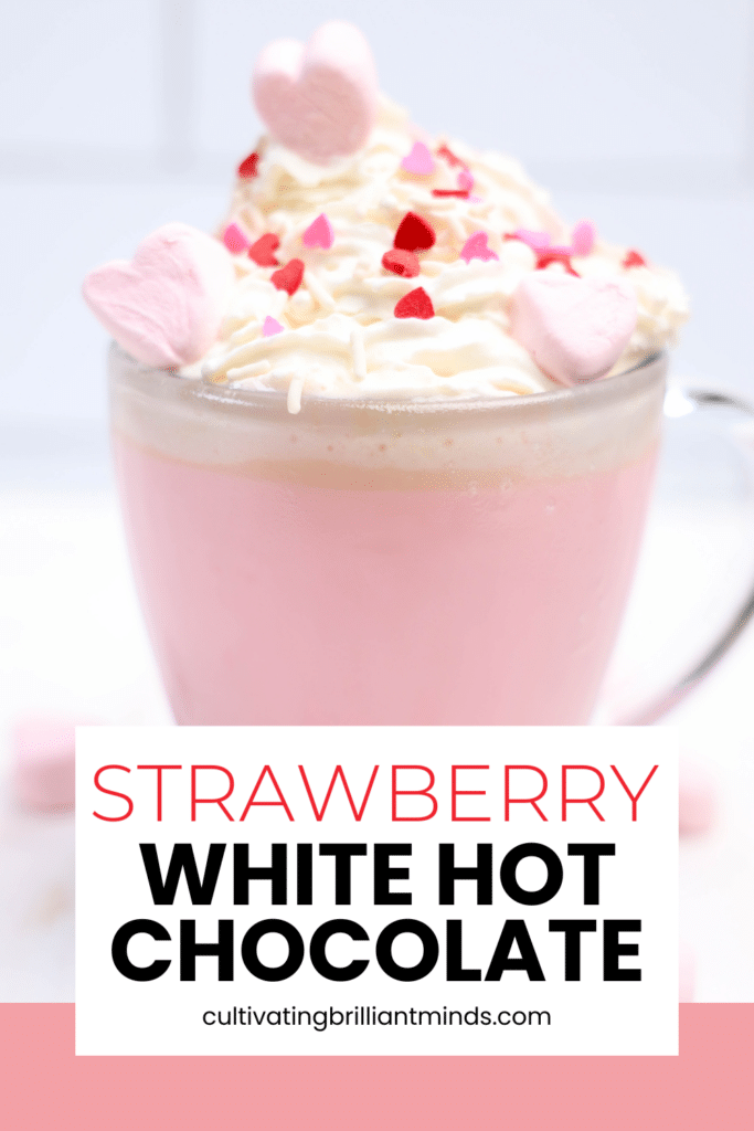 Strawberry White Hot Chocolate - Cultivating Brilliant Minds strawberry white hot chocolate with whipped cream and heart sprinkles
