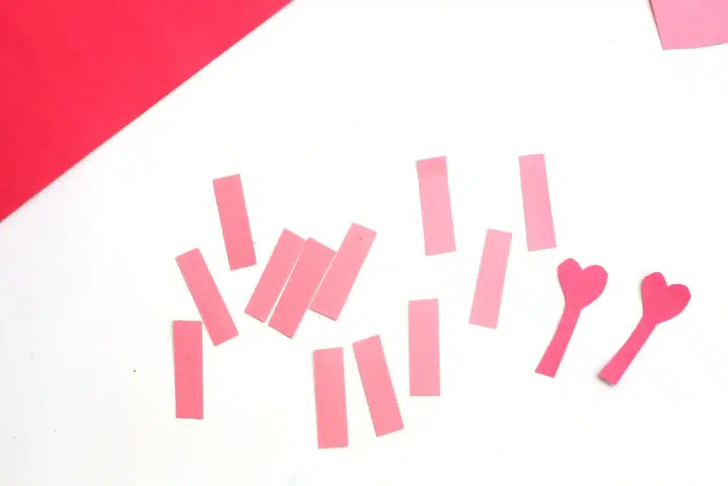 Heart Caterpillar Craft - Cultivating Brilliant Minds rectangles cut out of pink construction paper