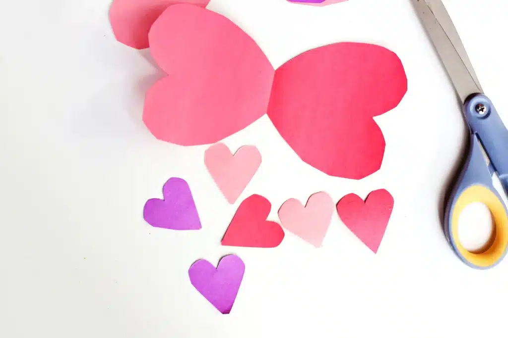 Love Bug Juices - Cultivating Brilliant Minds hearts and heart wings cut out of construction paper