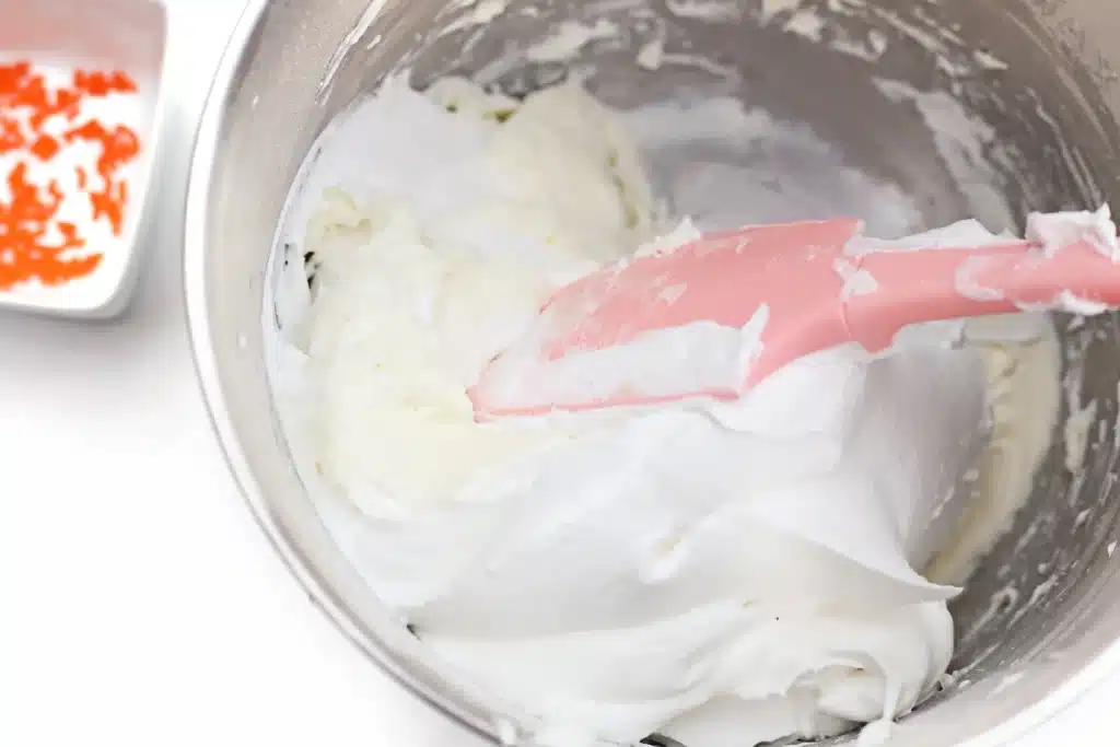 Melted Snowman Cheesecake Dip - Cultivating Brilliant Minds cream cheese, powdered sugar, and whipped topping in a bowl