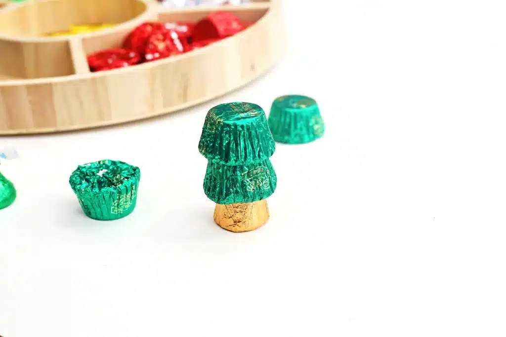 Candy Christmas Tree - Cultivating Brilliant Minds candies stacked on top of each other to look like a christmas tree