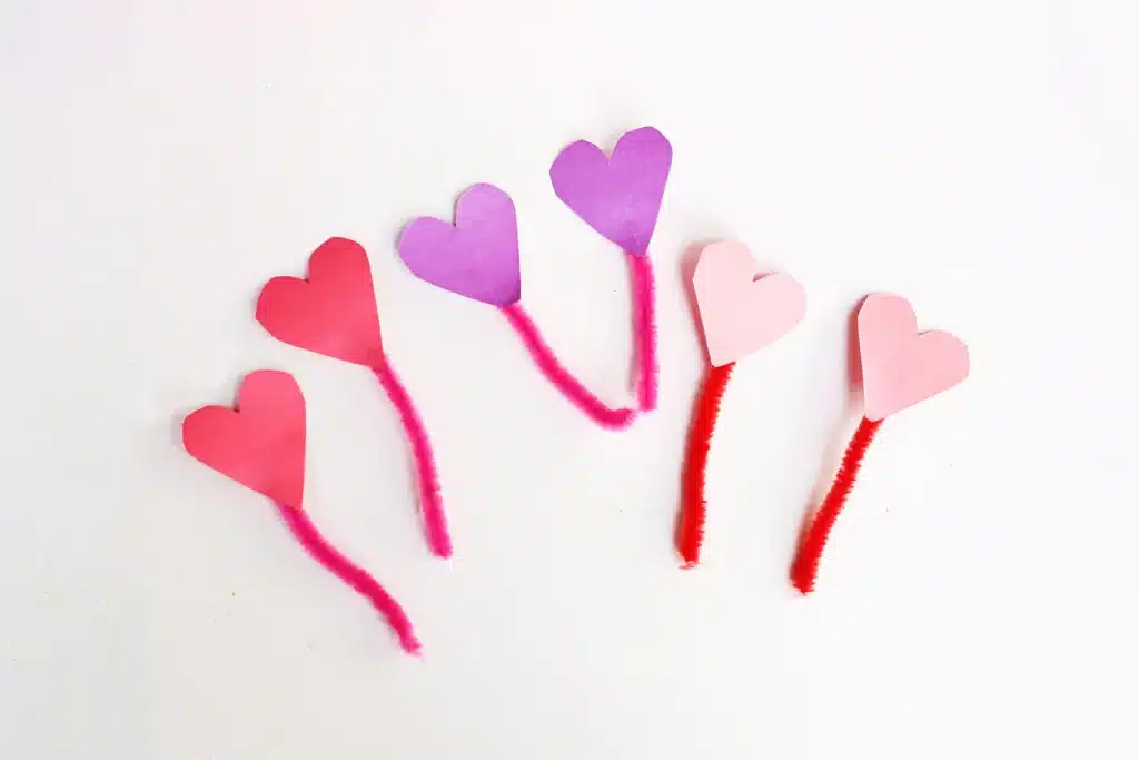 Love Bug Juices - Cultivating Brilliant Minds pipe cleaners with construction paper hearts glued to the top to look like antennae