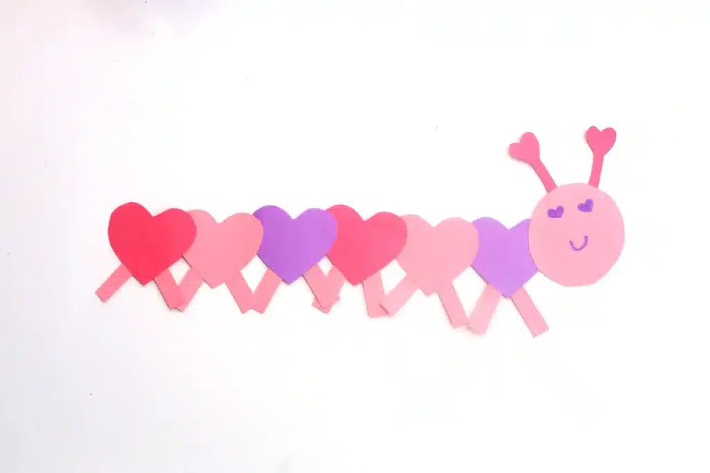 Heart Caterpillar Craft - Cultivating Brilliant Minds a caterpillar that has hearts for the body made out of construction paper