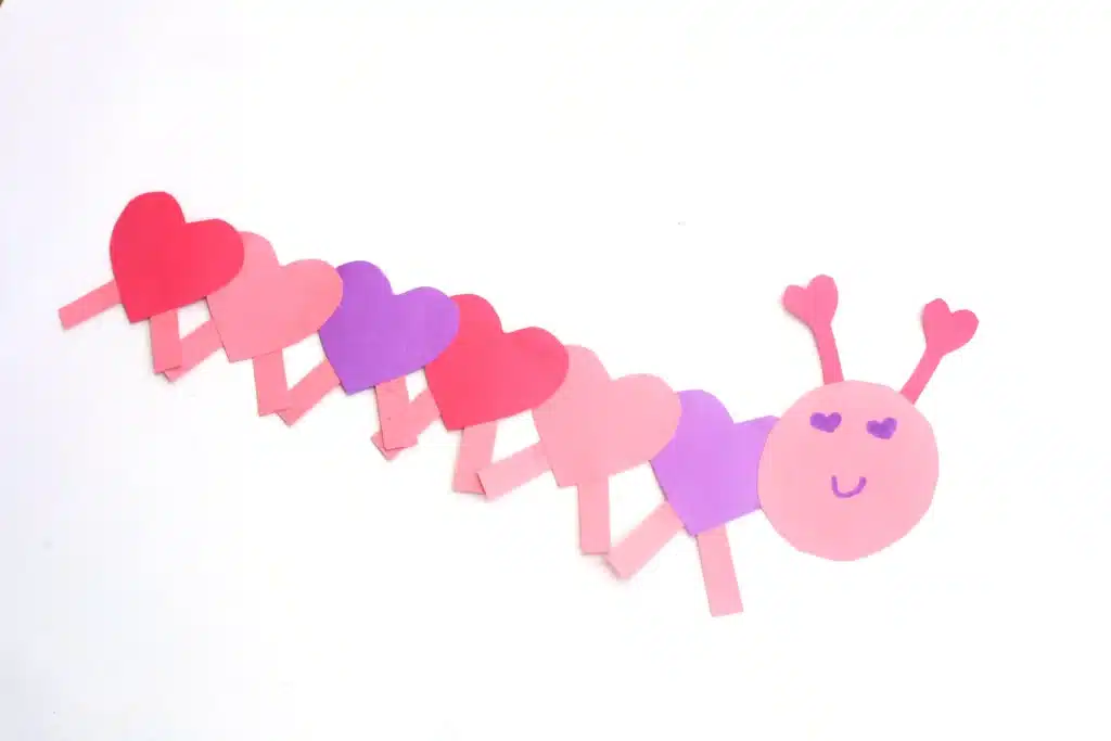 Heart Caterpillar Craft - Cultivating Brilliant Minds a caterpillar that has hearts for the body made out of construction paper