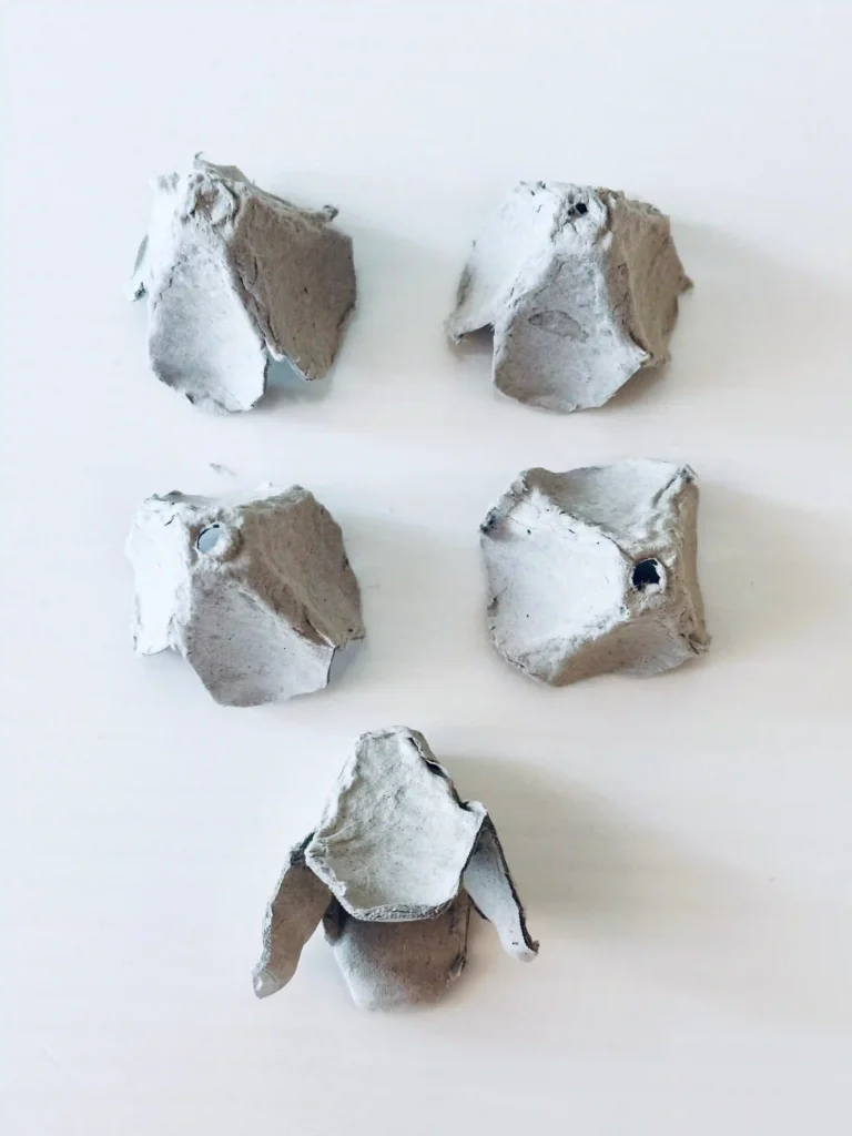 Egg Carton Sensory Bin - Cultivating Brilliant Minds an egg carton cut into pieces