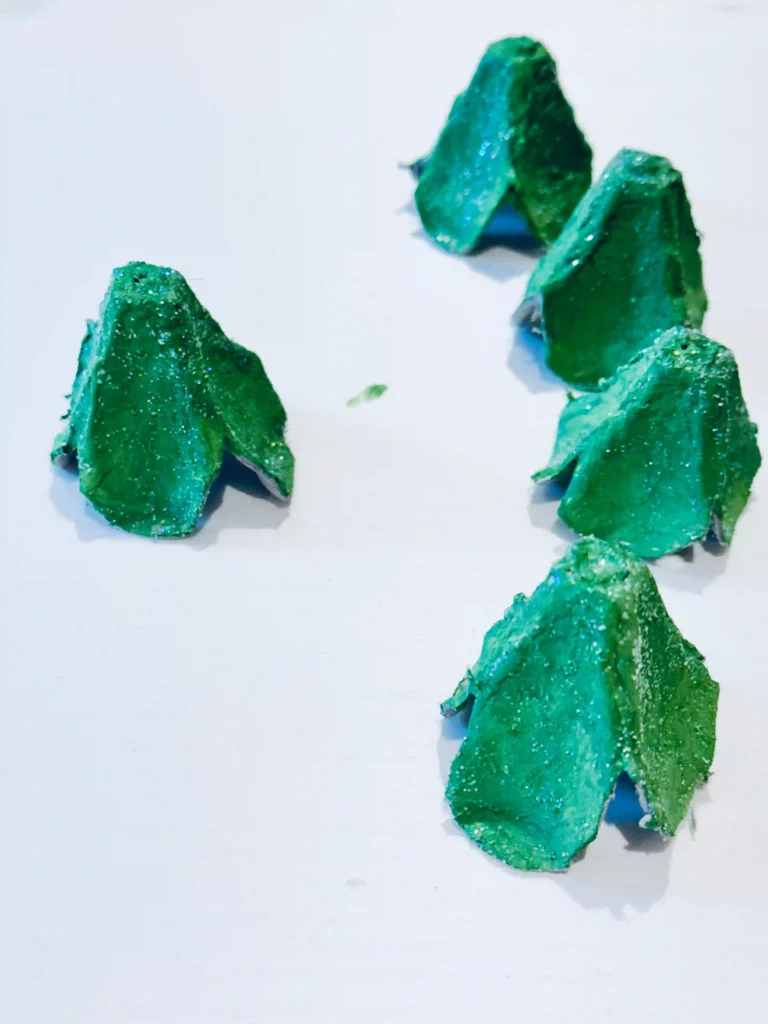 Egg Carton Sensory Bin - Cultivating Brilliant Minds egg carton painted green