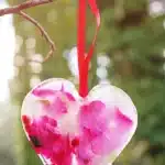 Ice Heart Suncatchers - Cultivating Brilliant Minds ice heart suncatcher made with leaves, petals, and betties