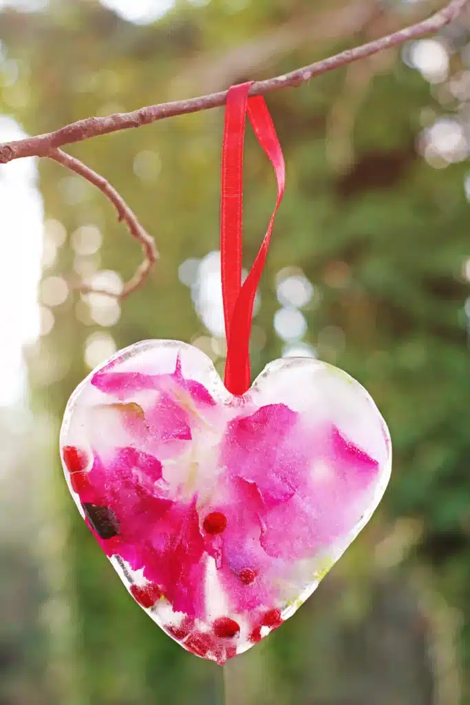 Ice Heart Suncatchers - Cultivating Brilliant Minds ice heart suncatcher made with leaves, petals, and betties