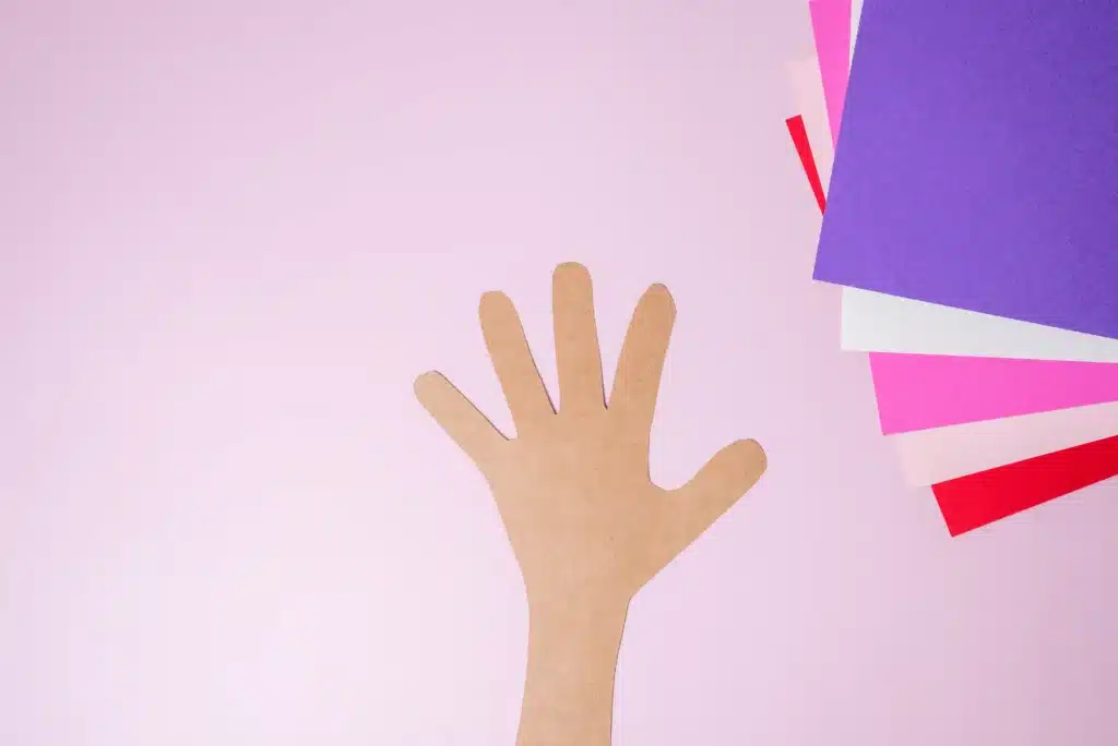 Valentine's Day Heart Tree Craft - Cultivating Brilliant Minds a child's hand and arm traced and cut out of construction paper