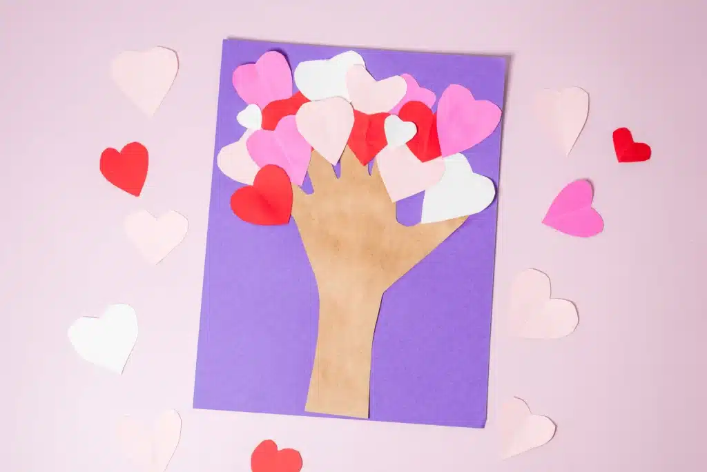 Valentine's Day Heart Tree Craft - Cultivating Brilliant Minds valentine's day handprint heart tree craft with the trunk a traced handprint and the tree is made of hearts