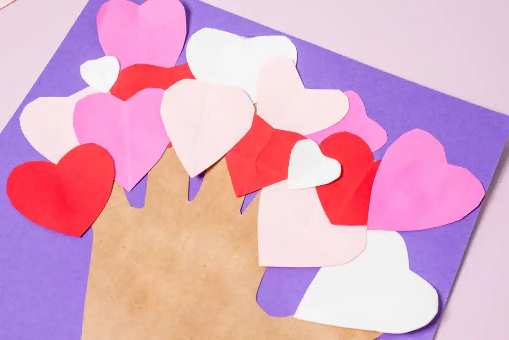 Valentine's Day Heart Tree Craft - Cultivating Brilliant Minds valentine's day handprint heart tree craft with the trunk a traced handprint and the tree is made of hearts