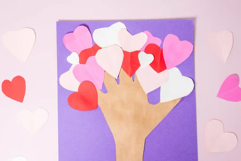 Valentine's Day Heart Tree Craft - Cultivating Brilliant Minds valentine's day handprint heart tree craft with the trunk a traced handprint and the tree is made of hearts