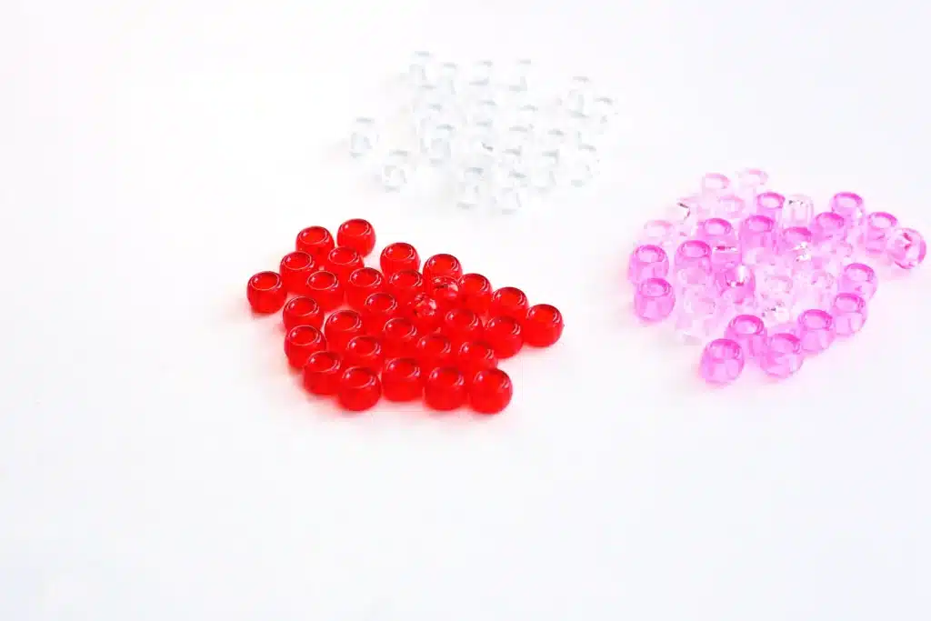 Pipe Cleaner Heart Lacing Fine Motor Activity - Cultivating Brilliant Minds red, white, and pink pony beads