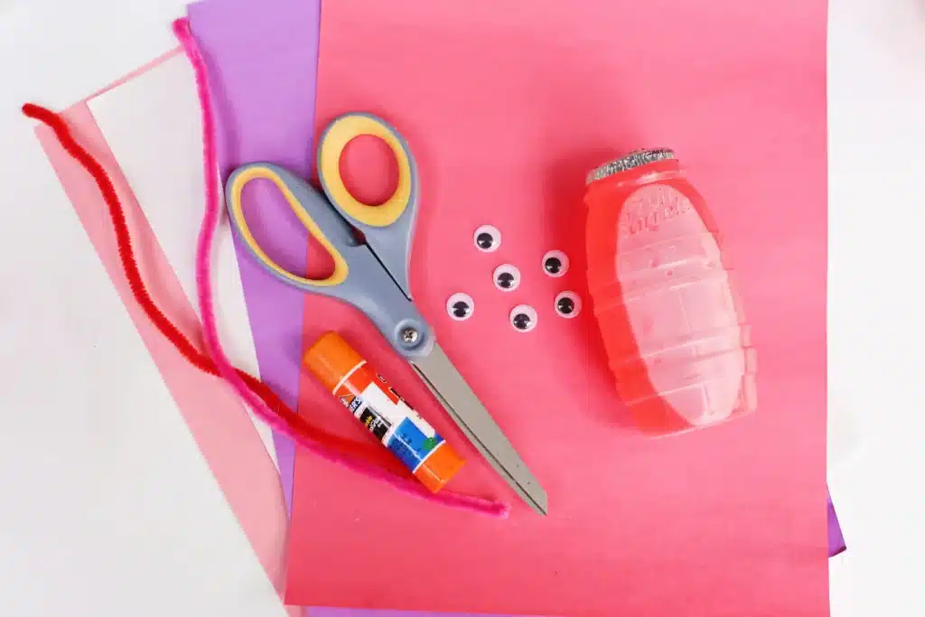 Love Bug Juices - Cultivating Brilliant Minds construction paper, scissors, googly eyes, glue, hugs juice, and red pipe cleaners