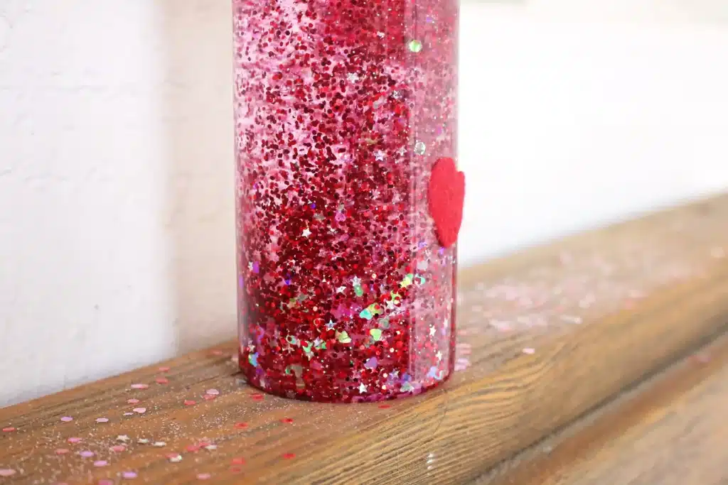 Love Potion Valentine Sensory Bottle - Cultivating Brilliant Minds love potion valentine's sensory bottle with red glitter for valentine's day