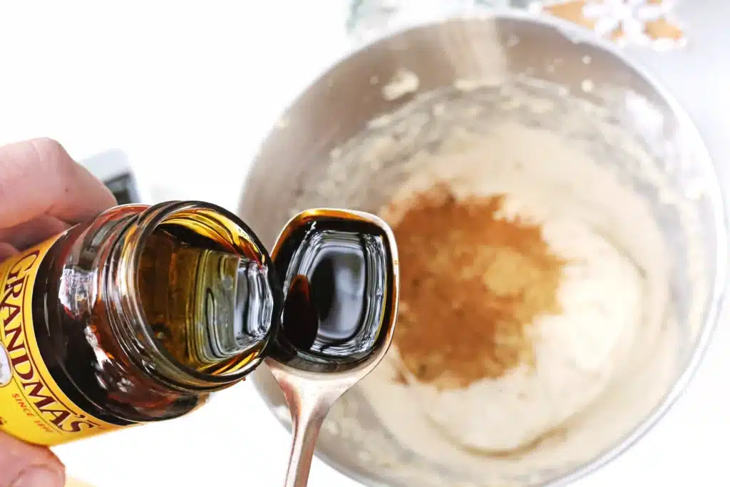 Gingerbread Dip - Cultivating Brilliant Minds measuring molasses on a measuring spoon