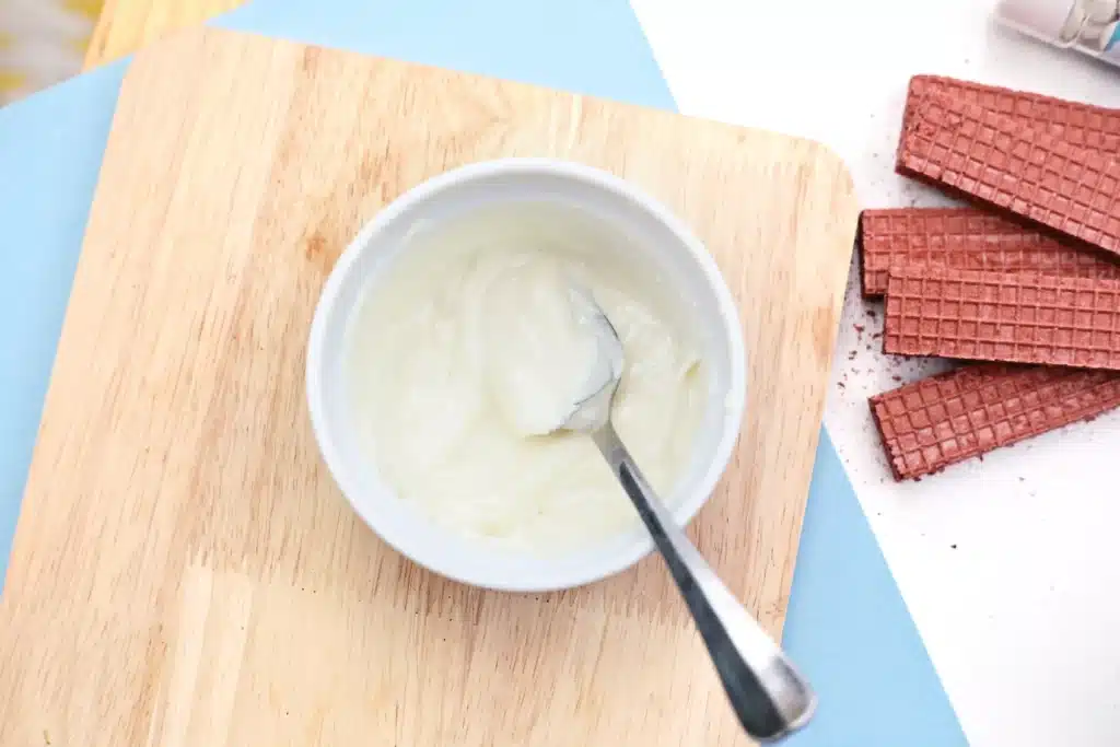 Penguin Wafers - Cultivating Brilliant Minds white candy melts melted in a bowl