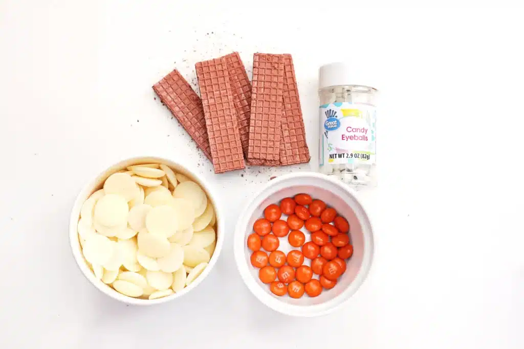 Penguin Wafers - Cultivating Brilliant Minds chocolate waters, m&ms, white candy melts, and candy eyes
