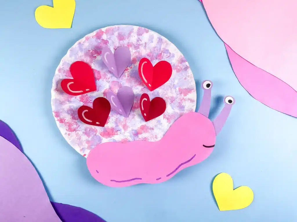 Valentine's Day Snail Craft - Cultivating Brilliant Minds paper plate snail craft with hearts for valentine's day