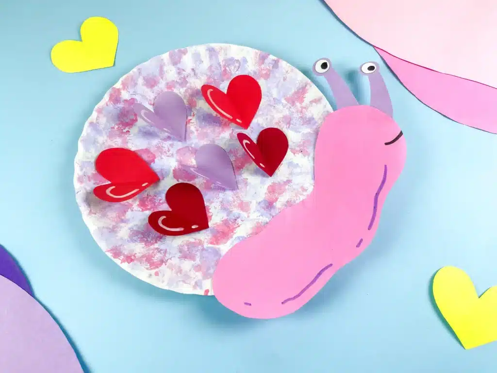 Valentine's Day Snail Craft - Cultivating Brilliant Minds paper plate snail craft with hearts for valentine's day