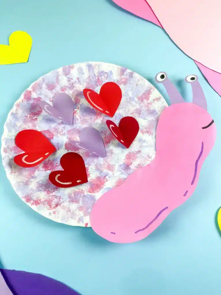 Valentine's Day Snail Craft - Cultivating Brilliant Minds paper plate snail craft with hearts for valentine's day