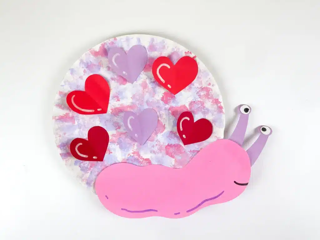 Valentine's Day Snail Craft - Cultivating Brilliant Minds paper plate snail craft with hearts for valentine's day