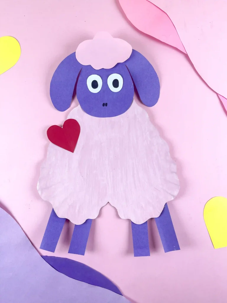 valentine's day craft for kids: a paper plate cut into a heart and construction paper cut to look like a sheep