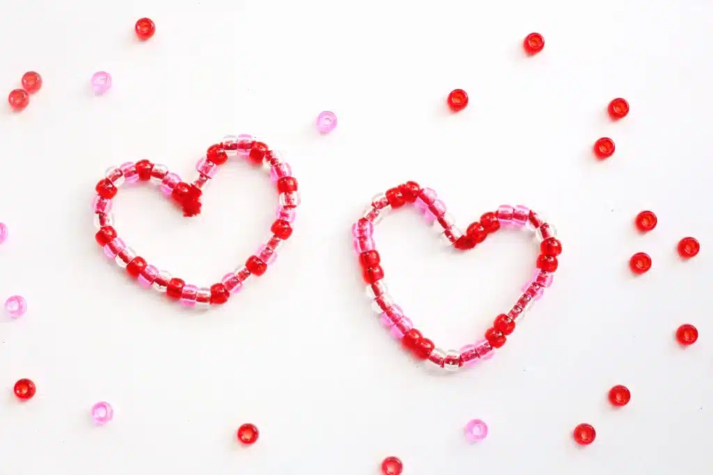 Pipe Cleaner Heart Lacing Fine Motor Activity - Cultivating Brilliant Minds Pipe Cleaner Heart Lacing Fine Motor Activity : beads laced onto pipe cleaners bent to look like hearts