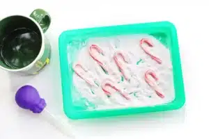 candy canes fizzing in baking soda and vinegar