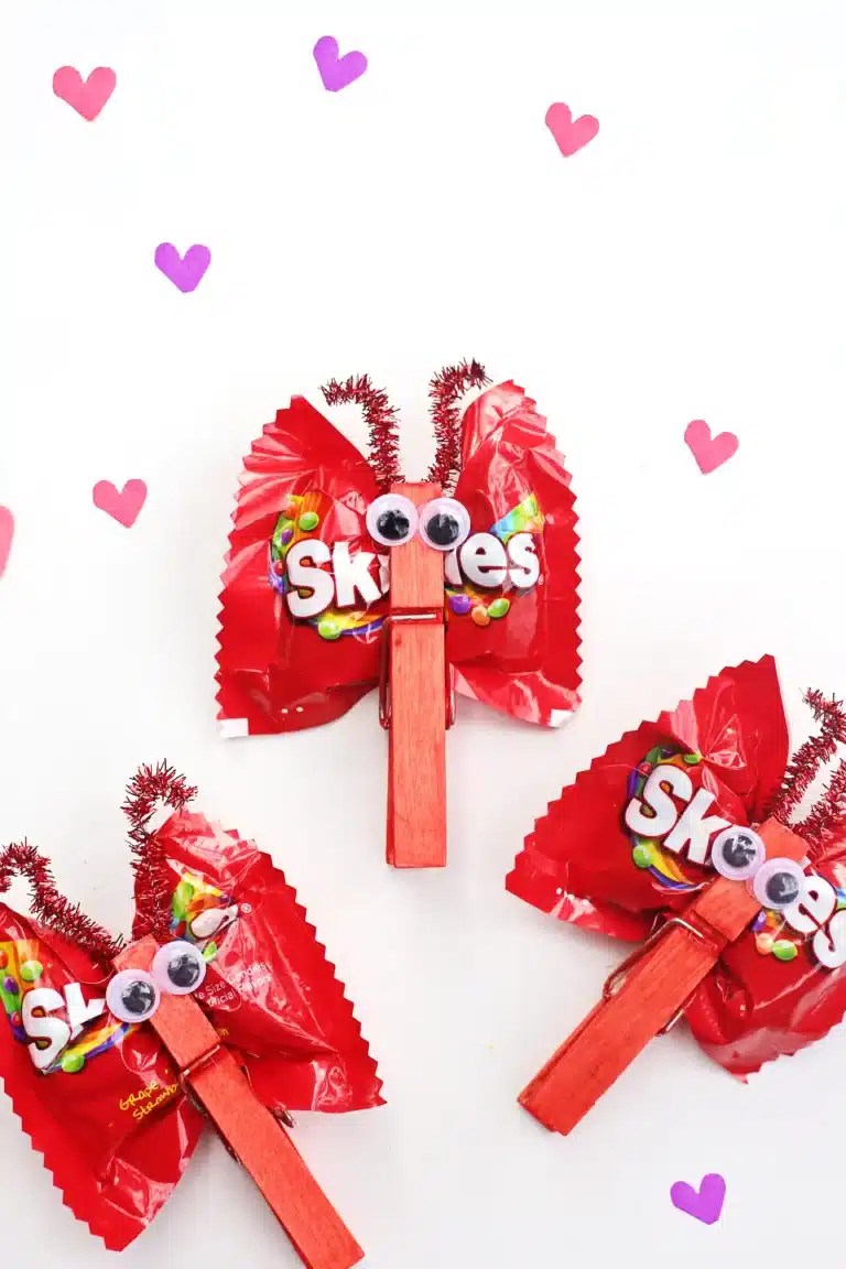 valentine candy love bugs using a clothespins and snack bags of skittles