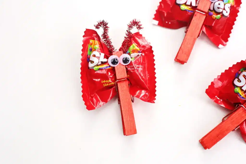 Valentine Candy Love Bugs - Cultivating Brilliant Minds valentine candy love bugs using a clothespins and snack bags of skittles
