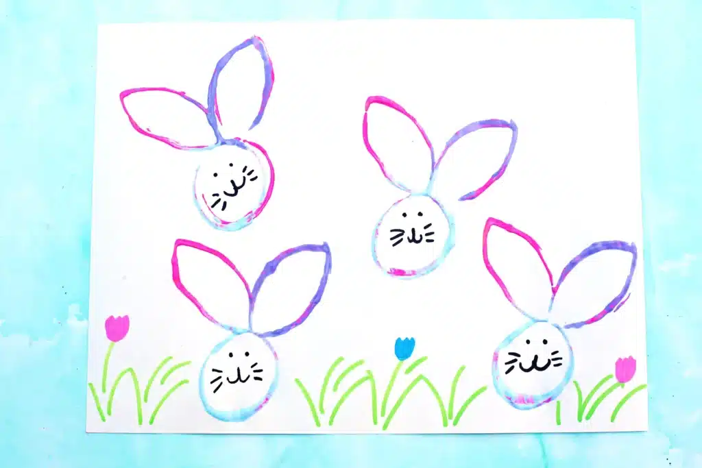 Bunny Stamp Art with Toilet Paper Rolls - Cultivating Brilliant Minds bunny stamp art on a piece of paper using a toilet paper roll