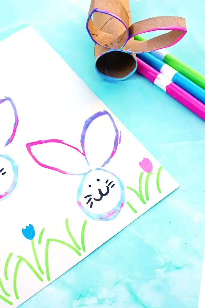 Bunny Stamp Art with Toilet Paper Rolls - Cultivating Brilliant Minds bunny stamp art on a piece of paper using a toilet paper roll