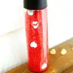 Valentine's Day Candy Heart Sensory Bottle - Cultivating Brilliant Minds a candy heart sensory bottle that uses red rice and candy hearts