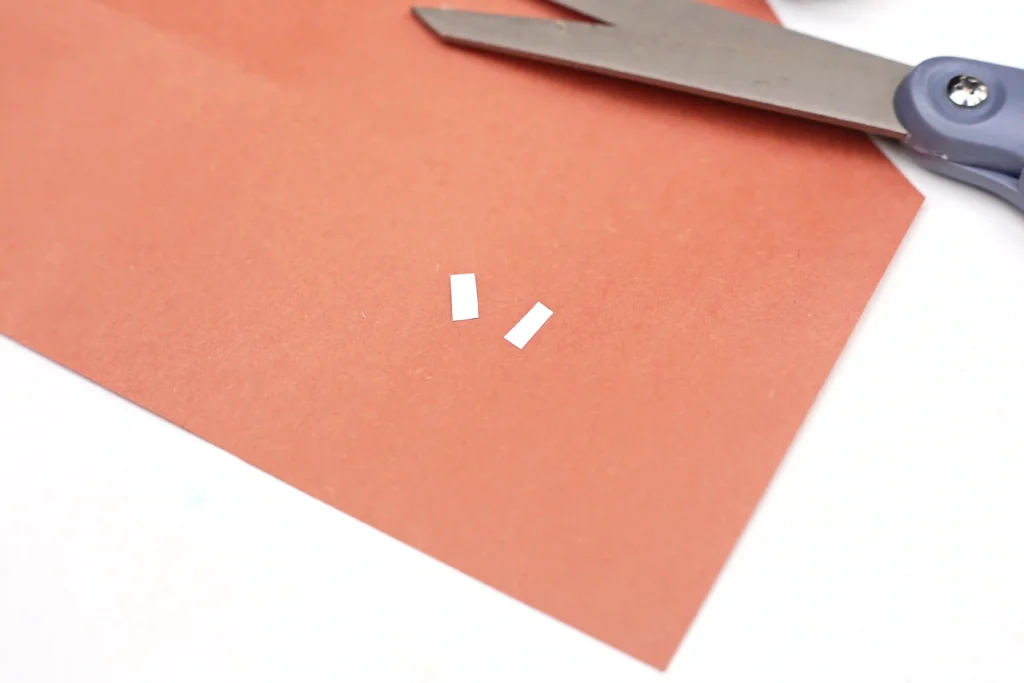 Groundhog Day Shadow Experiment - Cultivating Brilliant Minds two small strips cut out of white paper for the groundhog's teeth