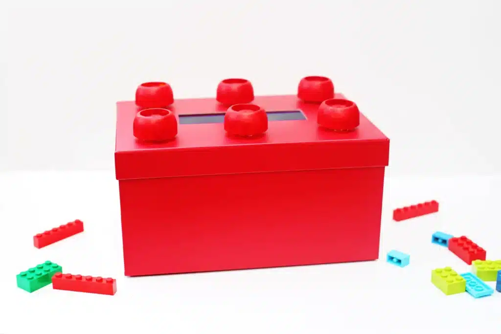 DIY LEGO Valentine Box - Cultivating Brilliant Minds a red box decorated to look like a lego for valentines