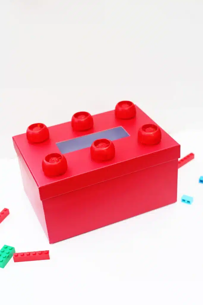 DIY LEGO Valentine Box - Cultivating Brilliant Minds a red box decorated to look like a lego for valentines